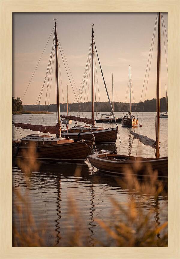 Sailboats Anchored In Tranquil Waters