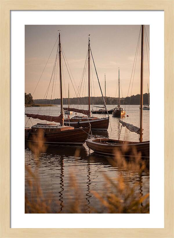 Sailboats Anchored In Tranquil Waters