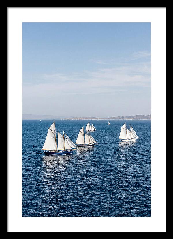 Sailboats Racing Across Blue Waters