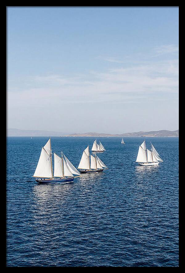 Sailboats Racing Across Blue Waters