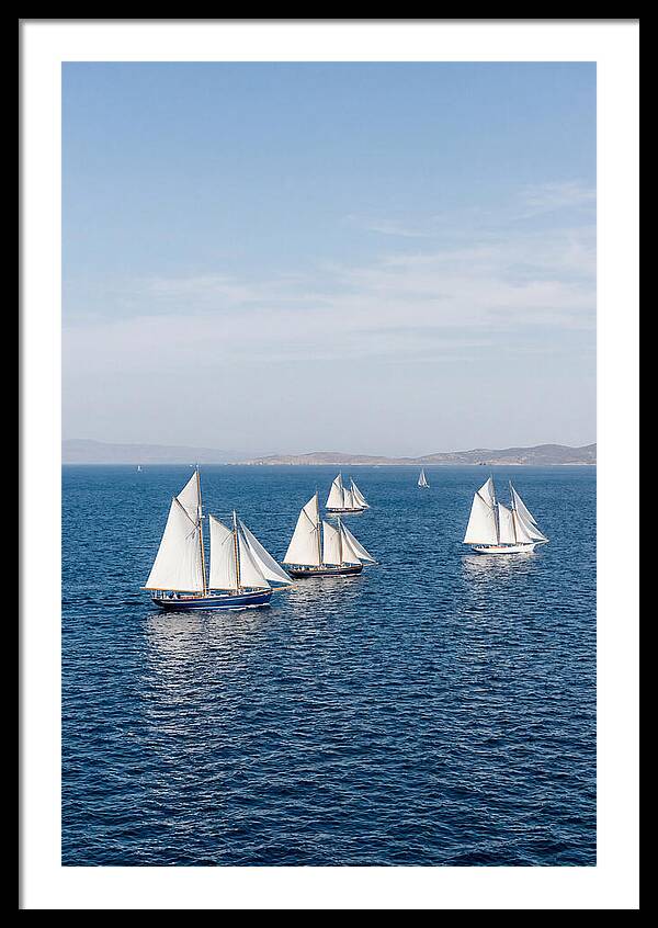 Sailboats Racing Across Blue Waters
