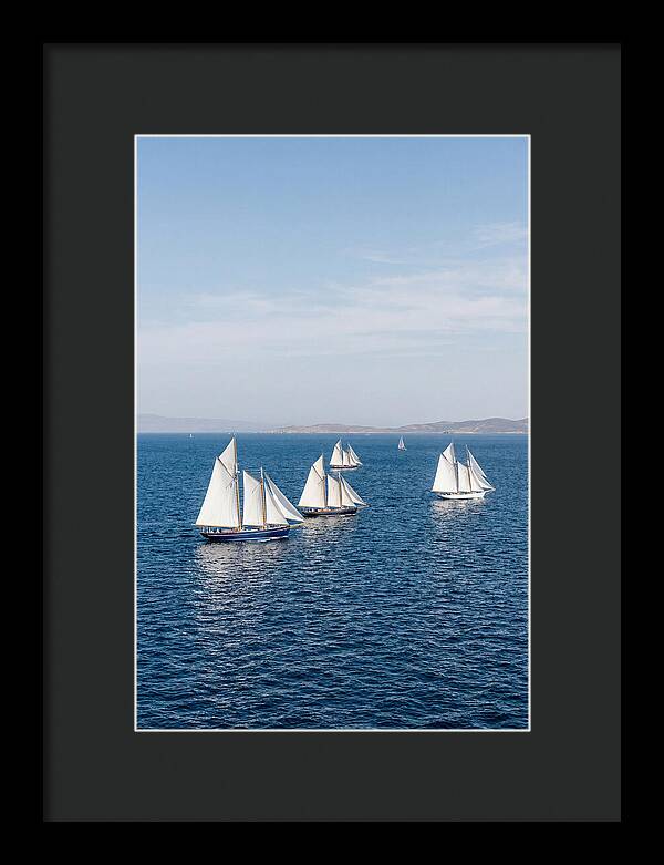 Sailboats Racing Across Blue Waters