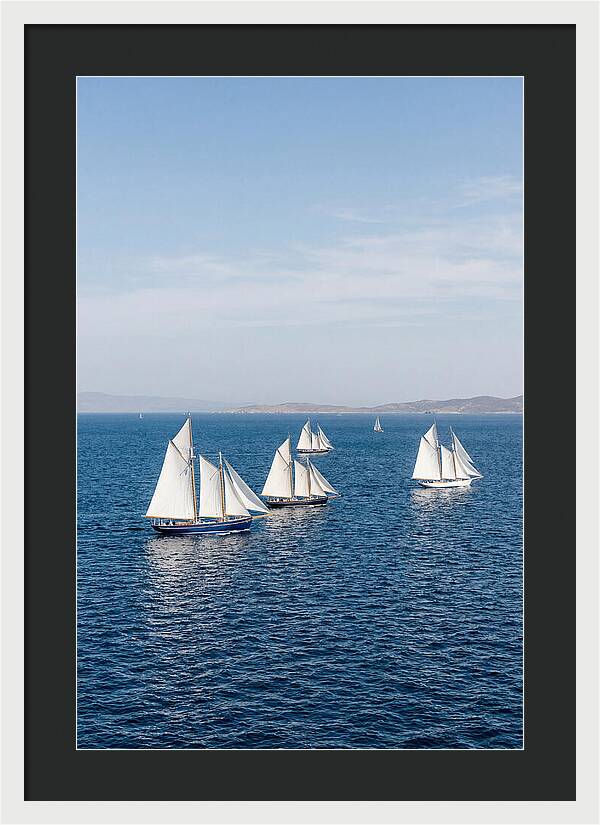 Sailboats Racing Across Blue Waters