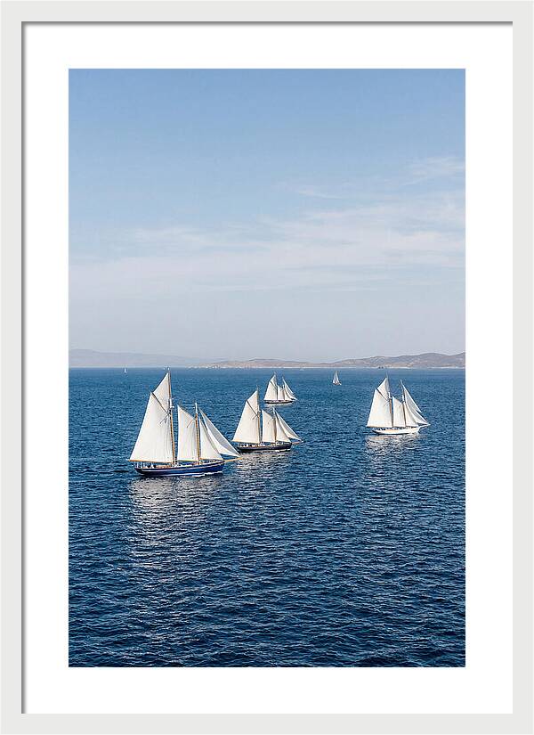 Sailboats Racing Across Blue Waters