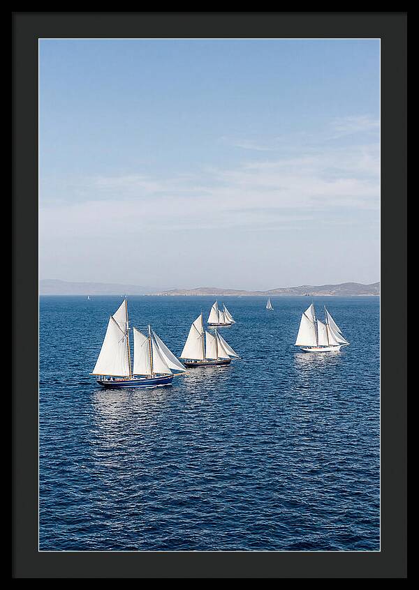 Sailboats Racing Across Blue Waters