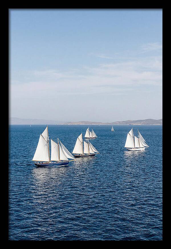 Sailboats Racing Across Blue Waters