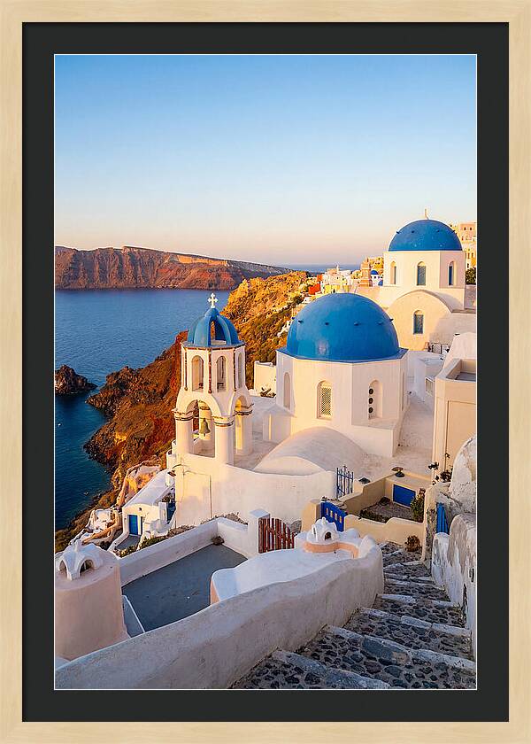 Santorinis Sunset Over Blue Domes