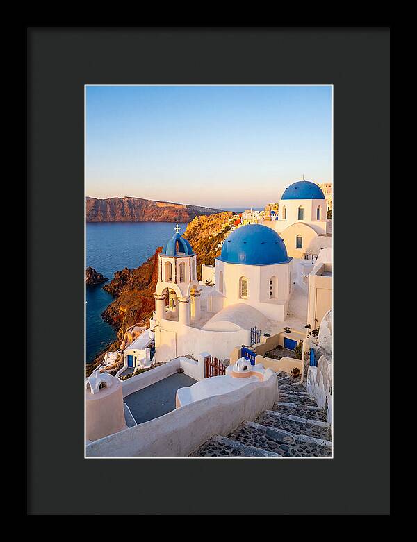 Santorinis Sunset Over Blue Domes