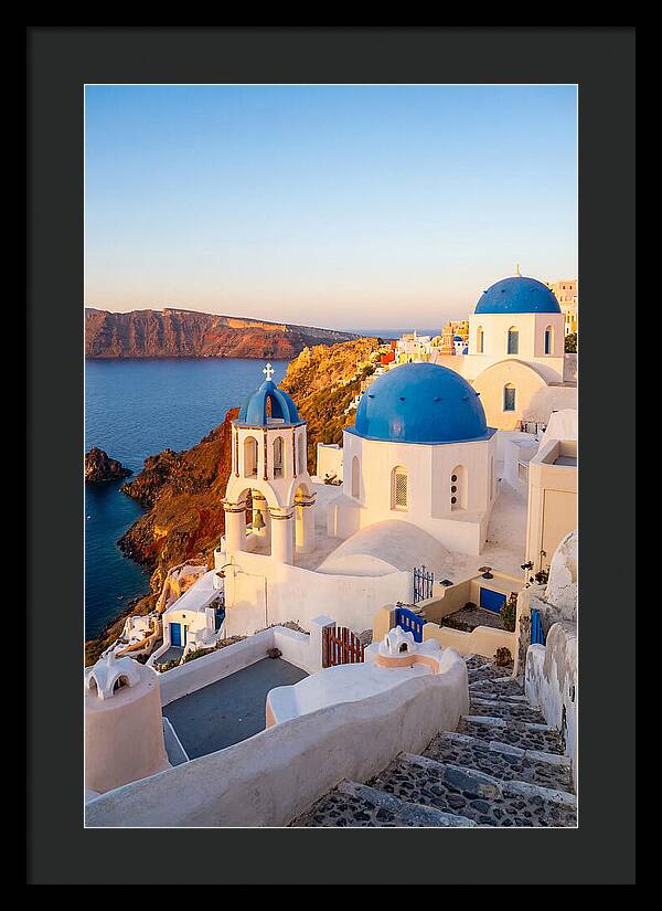 Santorinis Sunset Over Blue Domes