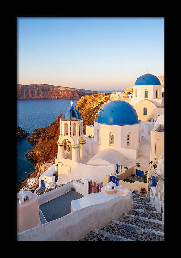 Santorinis Sunset Over Blue Domes