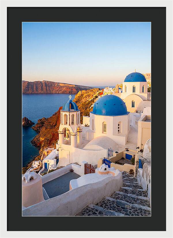 Santorinis Sunset Over Blue Domes