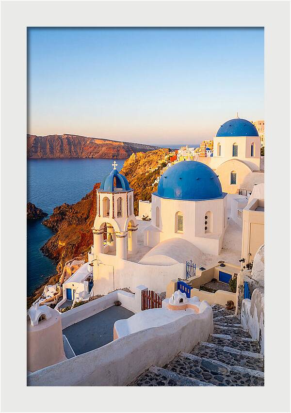 Santorinis Sunset Over Blue Domes