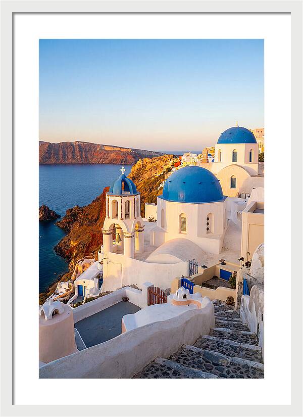 Santorinis Sunset Over Blue Domes
