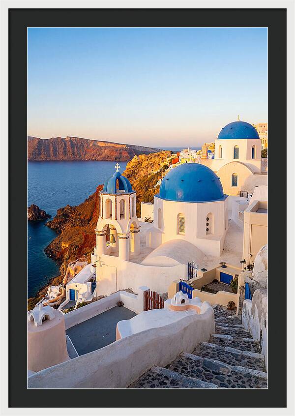 Santorinis Sunset Over Blue Domes