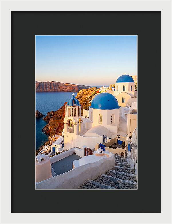 Santorinis Sunset Over Blue Domes