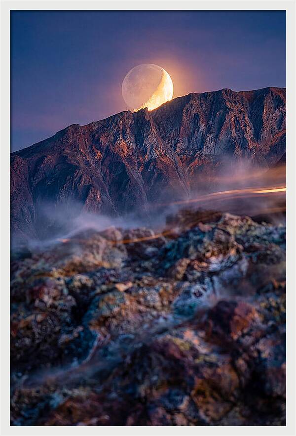 Serene Moonlight Above Towering Mountains