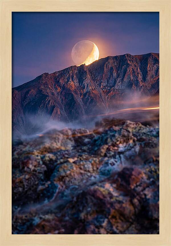 Serene Moonlight Above Towering Mountains