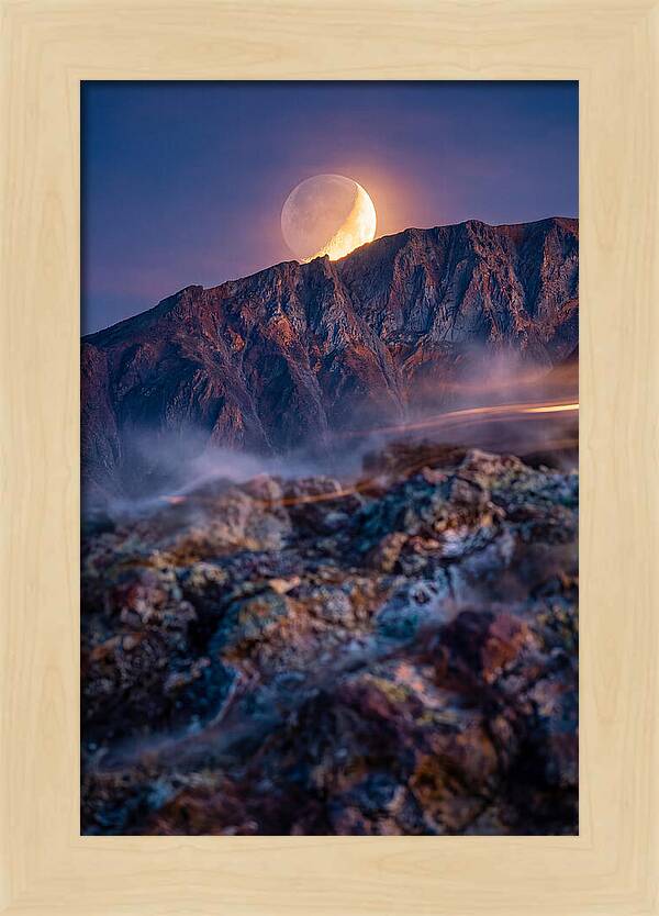Serene Moonlight Above Towering Mountains