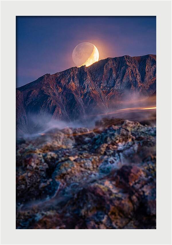 Serene Moonlight Above Towering Mountains