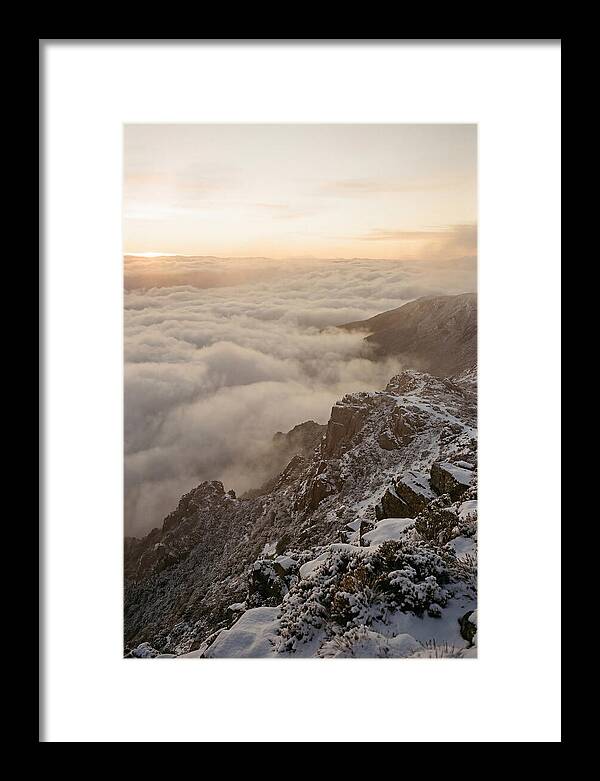 Snow Covered Ridge Line Above Sea Of Clouds