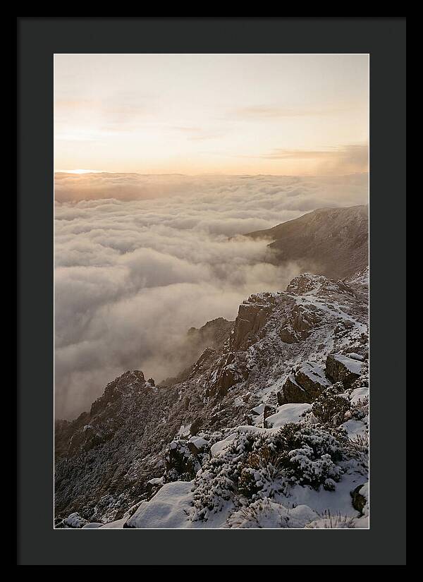 Snow Covered Ridge Line Above Sea Of Clouds