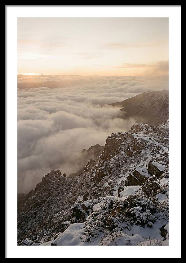 Snow Covered Ridge Line Above Sea Of Clouds