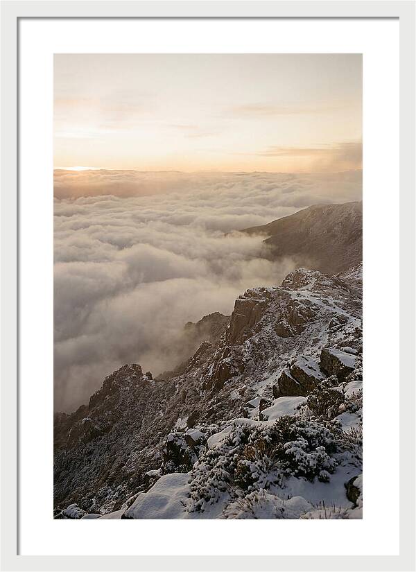 Snow Covered Ridge Line Above Sea Of Clouds