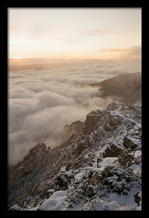 Snow Covered Ridge Line Above Sea Of Clouds