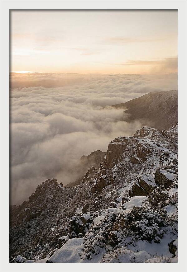 Snow Covered Ridge Line Above Sea Of Clouds