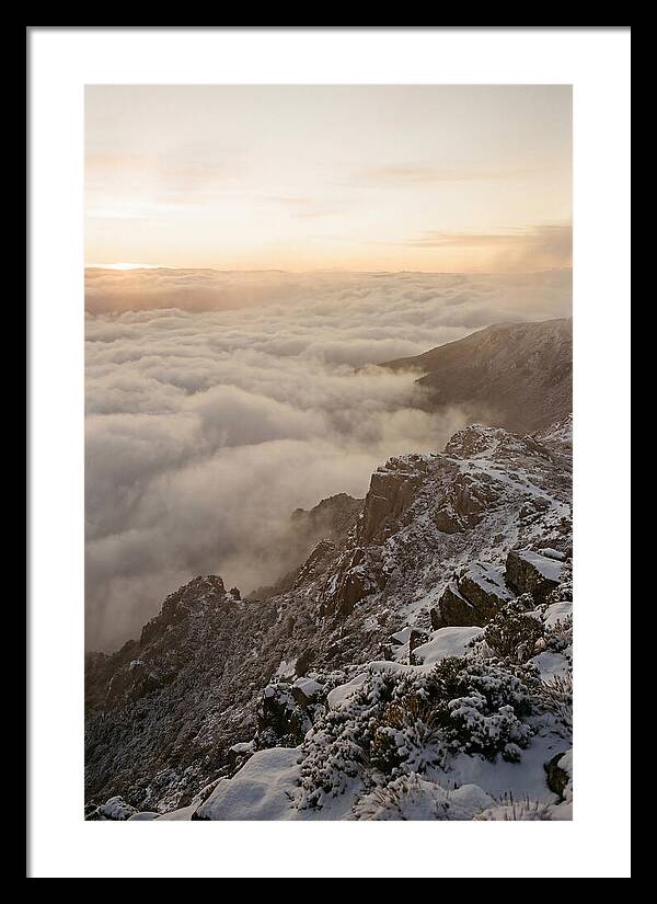 Snow Covered Ridge Line Above Sea Of Clouds