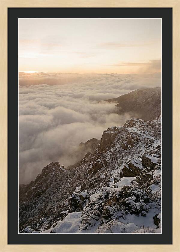 Snow Covered Ridge Line Above Sea Of Clouds