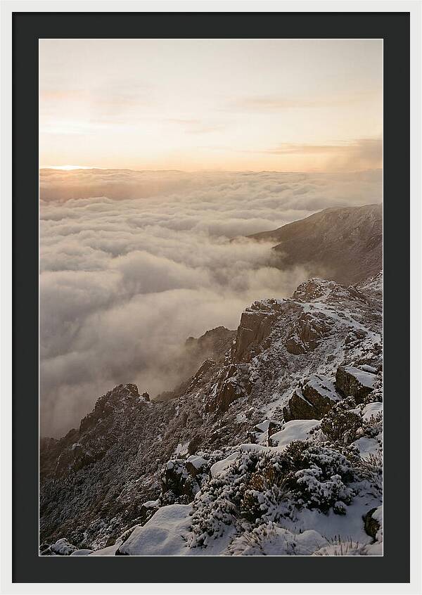 Snow Covered Ridge Line Above Sea Of Clouds