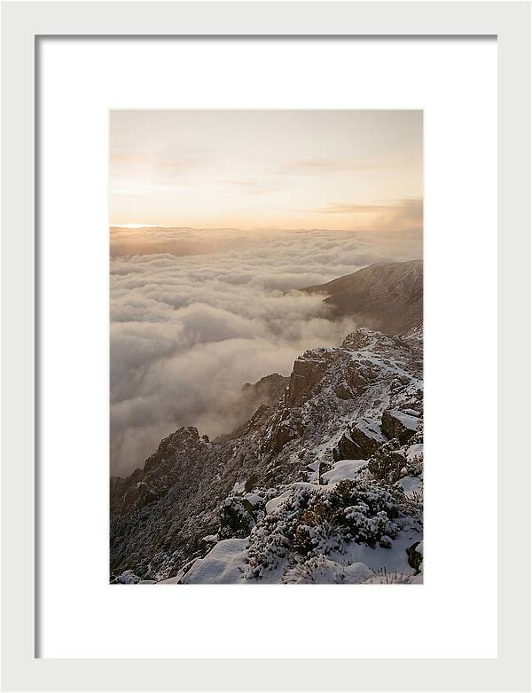 Snow Covered Ridge Line Above Sea Of Clouds