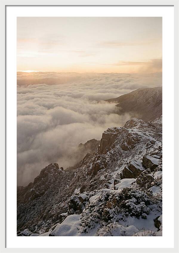 Snow Covered Ridge Line Above Sea Of Clouds
