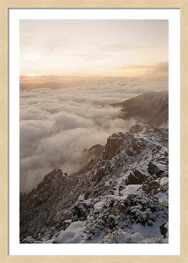 Snow Covered Ridge Line Above Sea Of Clouds