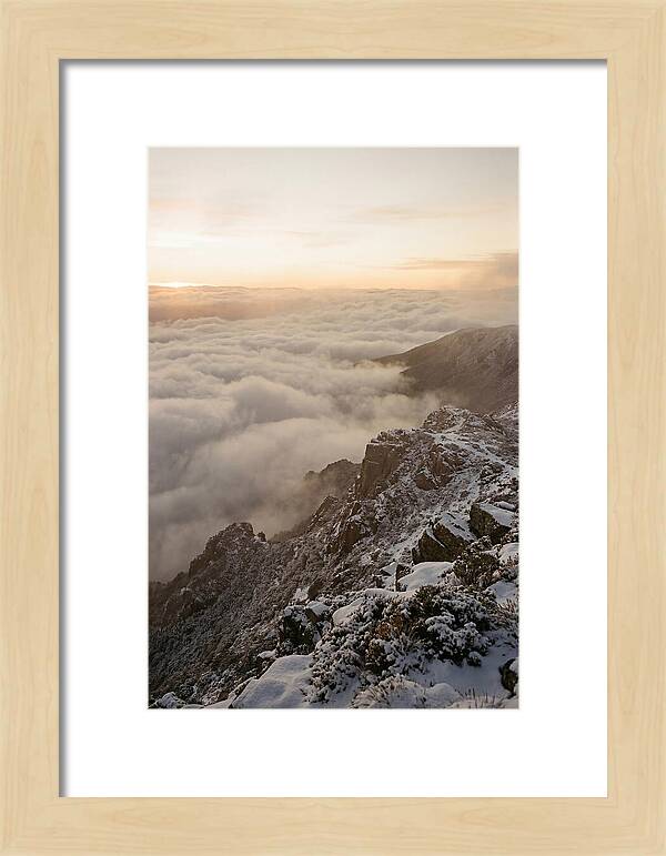 Snow Covered Ridge Line Above Sea Of Clouds