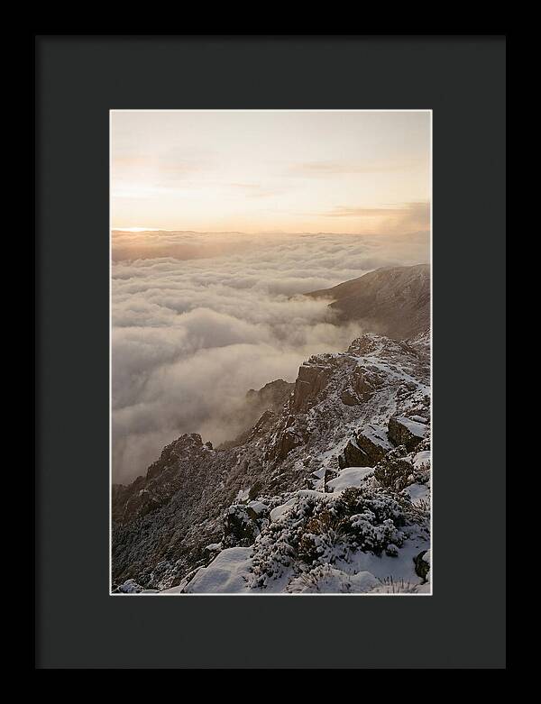 Snow Covered Ridge Line Above Sea Of Clouds