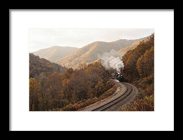 Steam Train Through Autumn Landscape