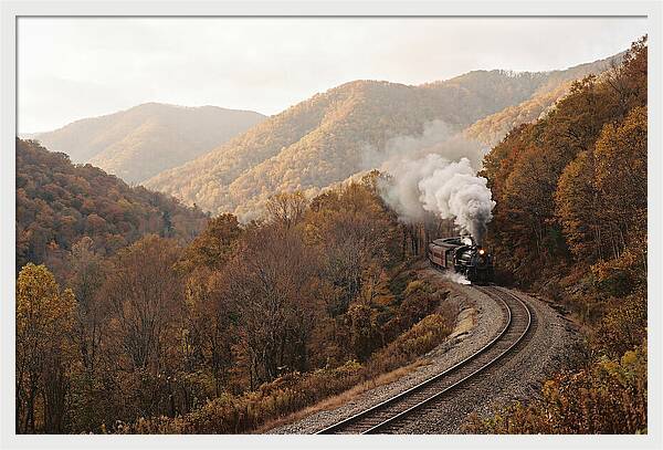 Steam Train Through Autumn Landscape