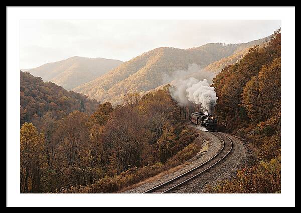 Steam Train Through Autumn Landscape