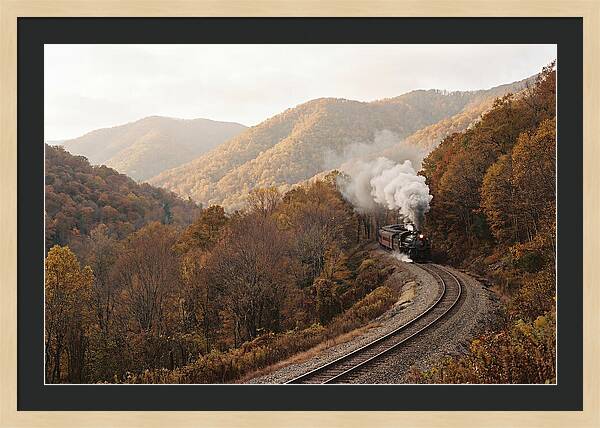 Steam Train Through Autumn Landscape