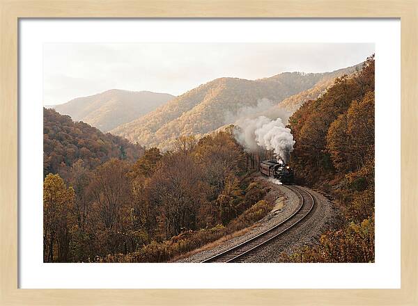 Steam Train Through Autumn Landscape