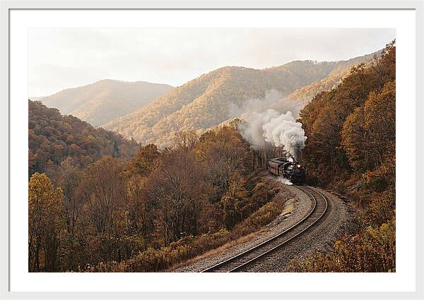 Steam Train Through Autumn Landscape