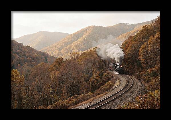 Steam Train Through Autumn Landscape