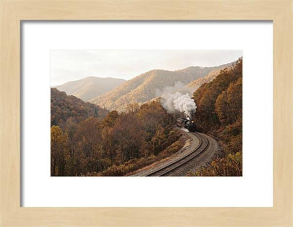 Steam Train Through Autumn Landscape