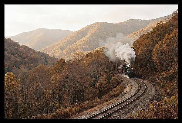 Steam Train Through Autumn Landscape