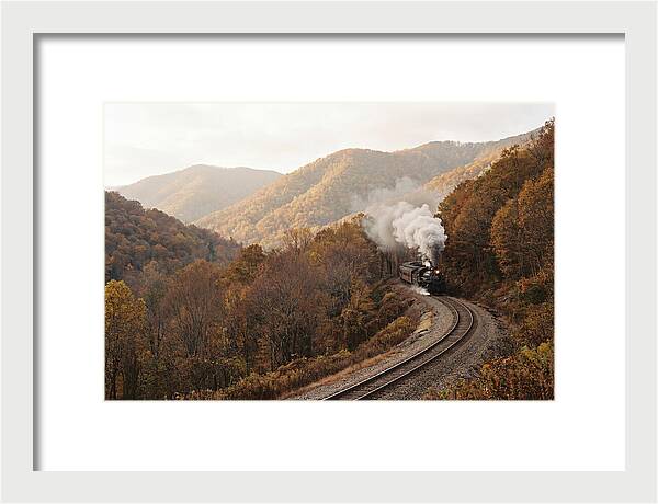 Steam Train Through Autumn Landscape