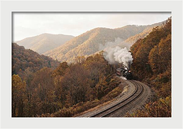 Steam Train Through Autumn Landscape