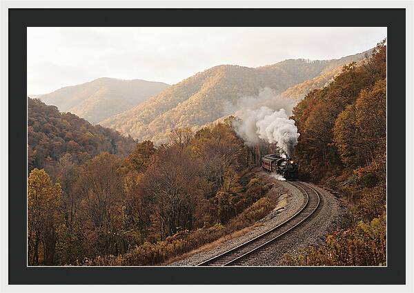 Steam Train Through Autumn Landscape