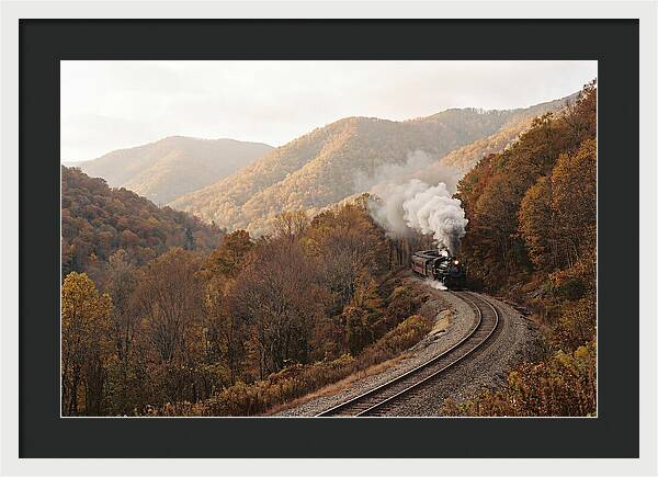 Steam Train Through Autumn Landscape